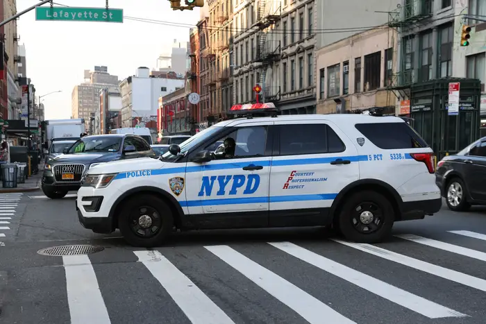 A police car drives through Manhattan on January 14, 2021. An annual report shows police were slower to respond to crimes from July 2021 to June of this year.